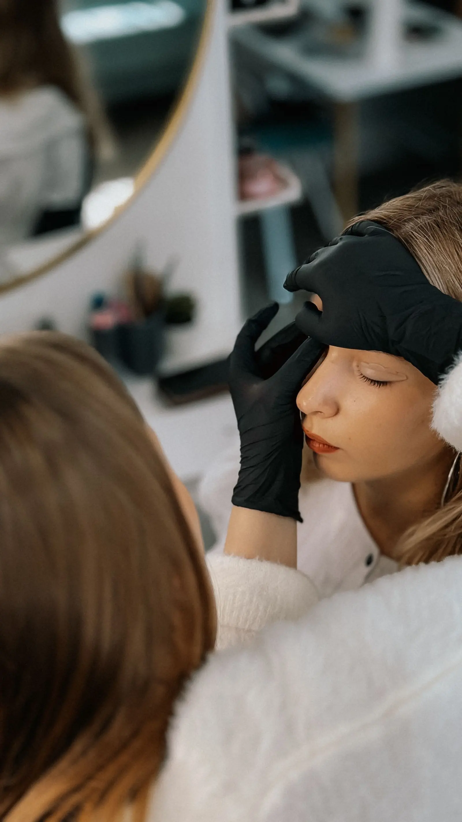 Beauty professional receiving hands-on training